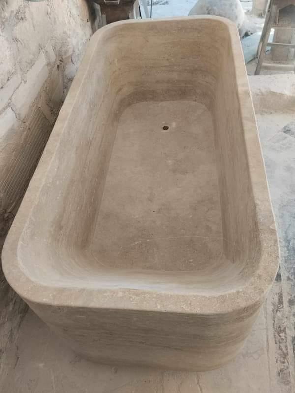 Travertino Bathtubs in stock or made to order. Hand Carved and Triple Polished by our crew.